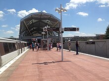 Wiehle-Reston East station on the first day of Silver Line service in 2014 Wiehle-Reston Metro platform 1.jpg