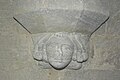 St. Peter's church: 13th-century Early English head corbel on north side of chancel arch