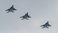 A formation of three F-15C/D Eagles overhead Kadena Air Base in Okinawa, Japan. The aircraft are assigned to the 18th Wing.