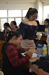 Prof. Theresia Katherine Rojas judging the participants' outputs