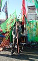 A flag seller on Imam Hossein festival - panoramio.jpg