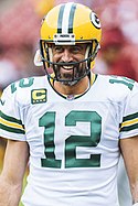 A photograph of Aaron Rodgers smiling in his Packers uniform
