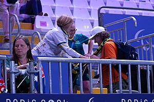 Paralympics Australia President Alison Creagh (left) and Australian Chef de Mission Kate McLoughlin (centre) present Hawkeye7 (talk) with a scarf