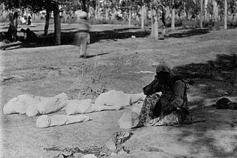 An Armenian mother beside the corpses of her five children