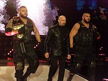 Paul Ellering (center) managing The Authors of Pain Authors of Pain NXT.jpg