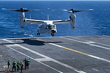 A CMV-22B lands on the USS-Nimitz (CVN-68) in March 2022. Bell-Boeing CVM-22B Osprey of VRM-50 lands on USS Nimitz (CVN-68) on 12 March 2022 (220312-N-DU622-1010).JPG