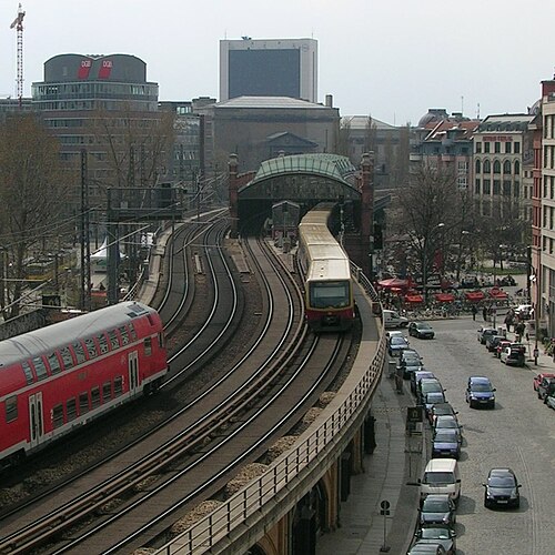 Part of Berlin Stadtbahn. The tracks on the right belong to the S-Bahn network and the trains stop at the Hackescher Markt station, while the other tw