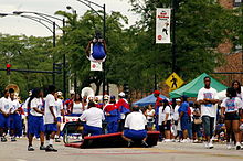 Anti-violence group for a Chicago high school in the 2008 parade. Billiken2008HighSchoolAntiViolenceAcrobats.jpg