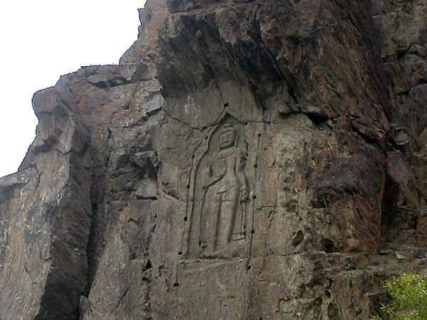 Photograph of Kargah Buddha in Gilgit; "The ancient Stupa – rock carvings of Buddha, everywhere in the region, point to the firm hold of Buddhism for 