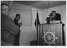 Buddhist service at the Manzanar War Relocation Center in 1943 Buddhist service-Adams-1943.jpg