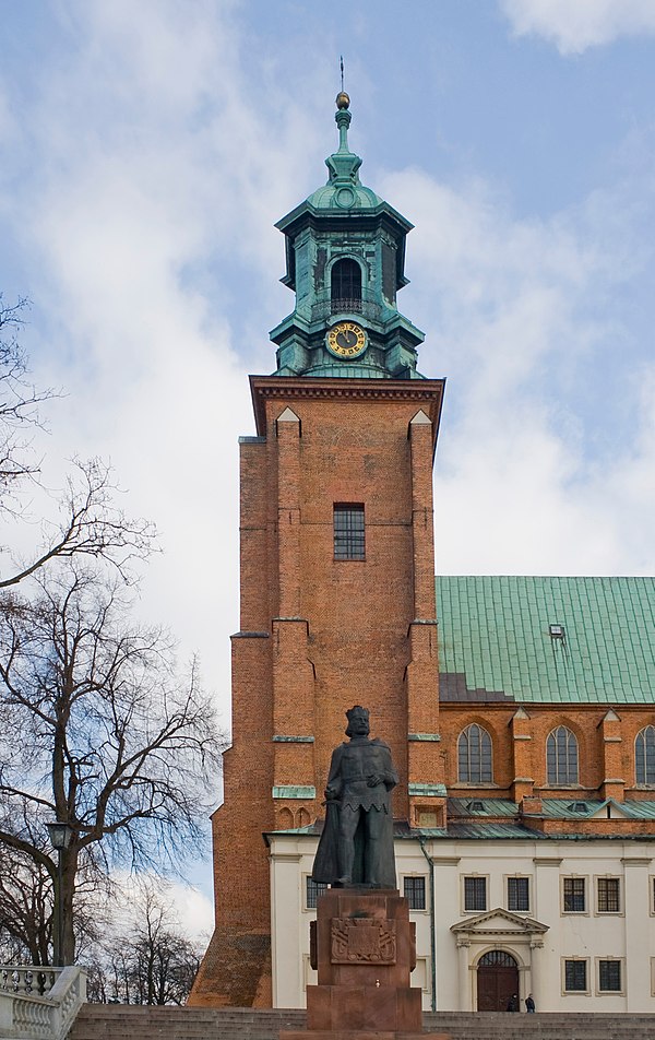 One of two frontal towers and a statue of Boleslaus I of Poland