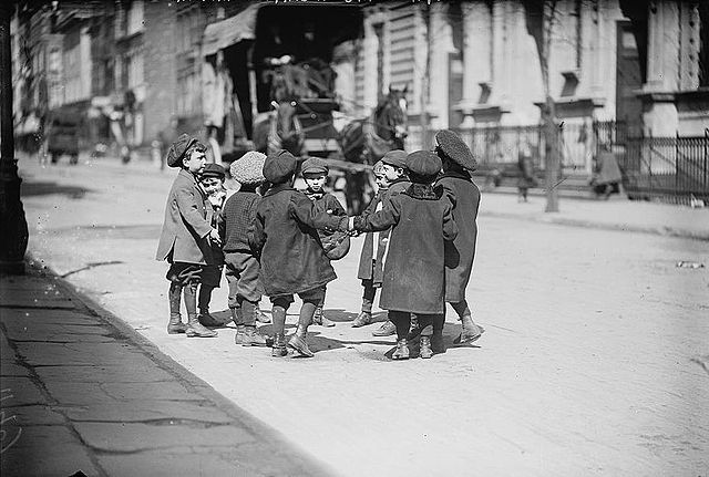 Young boys playing in a New York City street, 1909
