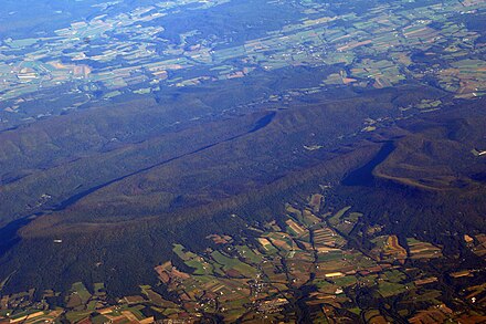 Aerial view of a portion of the Ridge-and-Valley Appalachians forming the northern edge of the Cumberland Valley. Named features in image include Flat Rock, Mount Dempsey, Bloserville, and Bowers Mountain.
