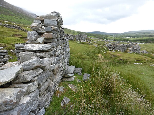 View of the deserted village from beside the ruins of one of the houses