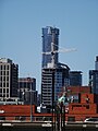 Distant construction cranes on Toronto's skyline, from the grassy knoll at Sugar Beach, 2016-08-07 (2) - panoramio.jpg