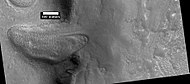Glacier moving out of valley, as seen by HiRISE under HiWish program Location is Ismenius Lacus quadrangle.