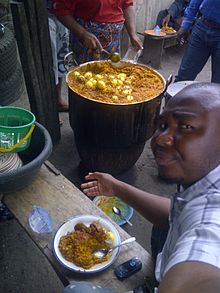 Palm oil rice (banga rice) served with assorted cuts of beef and boiled egg Eating Banga (Pam Seed) Rice..jpg