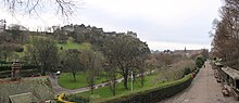 A view of West Princes Street Gardens running up to the Castle Hill Gardens with the rail line separating the gardens hidden Edinburgh Castle (12100322104).jpg