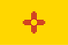 The club's branding draws inspiration from the Zia symbol, seen here on the state flag of New Mexico. Flag of New Mexico.svg