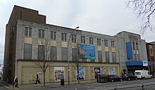 Seen in March 2013, the facade was boarded up and decorated with murals. Former Astoria Theatre, Gloucester Place, Brighton (March 2013).JPG