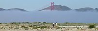 Fog envelops the Golden Gate Bridge and approa...