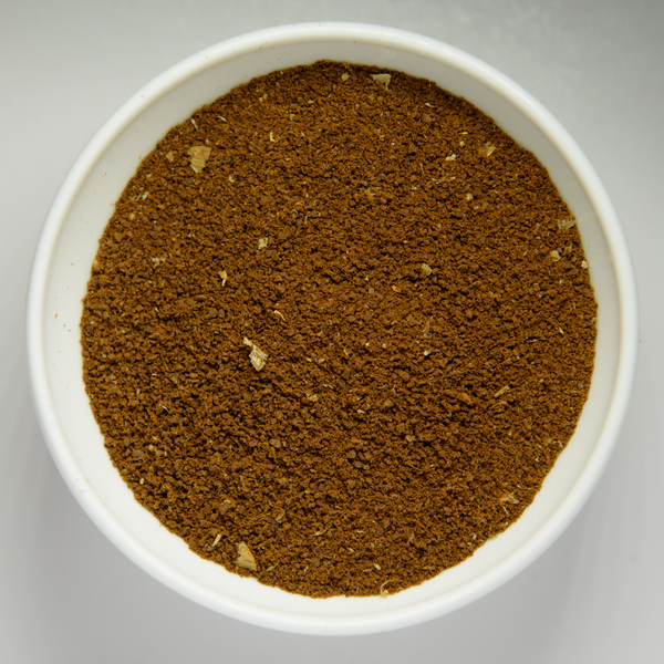 File:Grounded coffee beans in white bowl.png