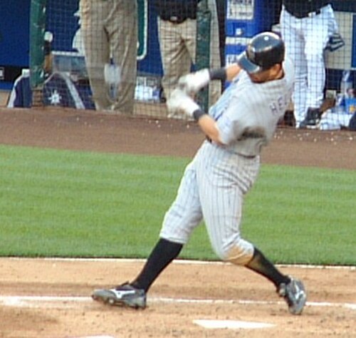 Helton swinging at a pitch during a game against the Seattle Mariners in 2006.