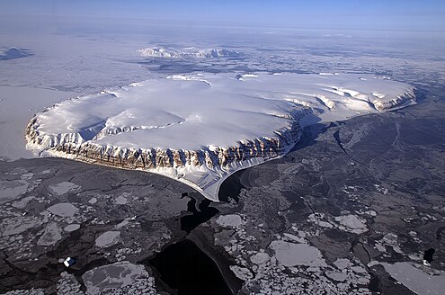 View of Saunders Island in the foreground and Wolstenholme Island in the background. IceBridge Survey Flight Over Saunders Island and Wolstenholme Fjord.jpg