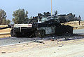 Destroyed US Military M1A1 Main Battle Tank (MBT) sits along Route 1, in Iraq, April 2003