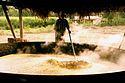Boiling the sugarcane juice in large-scale jaggery (gur) making in India