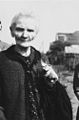 An elderly Polish woman poses with two silver spoons and a pair of scissors, all that remained of her home after it was destroyed in a German air raid during the siege of Warsaw. The woman's name is Mrs. Jaworska. Julien Bryan later learned that she died in 1940.}}