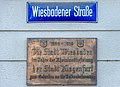 * Nomination Plaque and street sign on Wiesbadener Strasee, inner city, Klagenfurt, Carinthia, Austria -- Johann Jaritz 02:44, 9 September 2020 (UTC) * Promotion Good quality. --Bgag 02:57, 9 September 2020 (UTC)