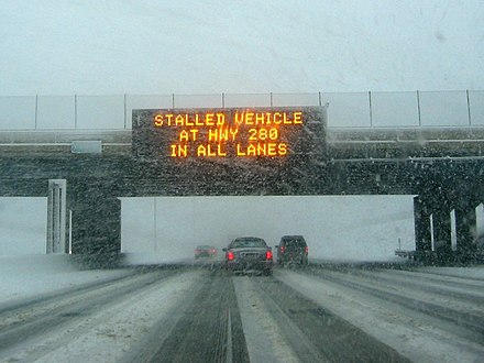 LED matrix sign over I-94 in Saint Paul, Minnesota, advising of a road blockage during a winter storm
