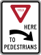 Yield here to pedestrians