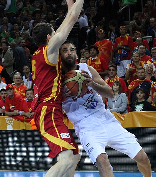 Navarro with Spain's national team attacking the paint against Macedonia's, in 2011.