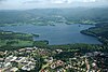 The wide forest/hills, ''Marka'', begins immediately at the built up area. Maridalen lake and ''Marka'' beyond.