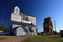 Historic grain elevators in Mortlach. Former Saskatchewan Wheat Pool on right under demolition.