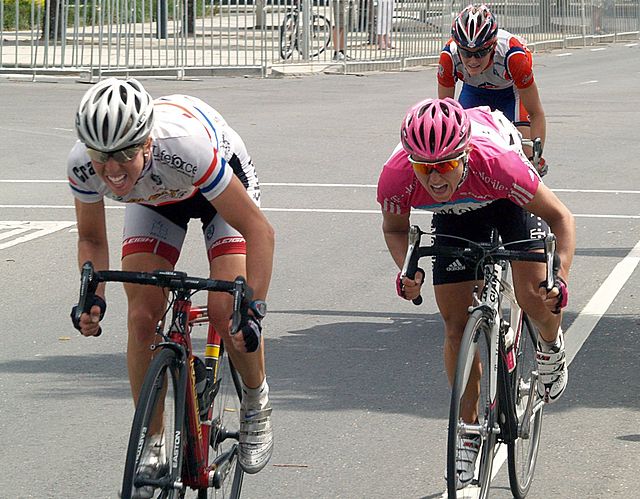 Two women in a tight sprint finish at the end of the Australia World Cup cycling race