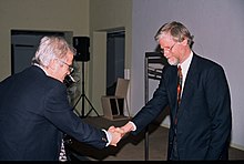 Norwegian architect Niels A. Torp receiving the 1999 Jacob Prize award from Peter Butenschon. Niels Torp Peter Butenschon.jpg