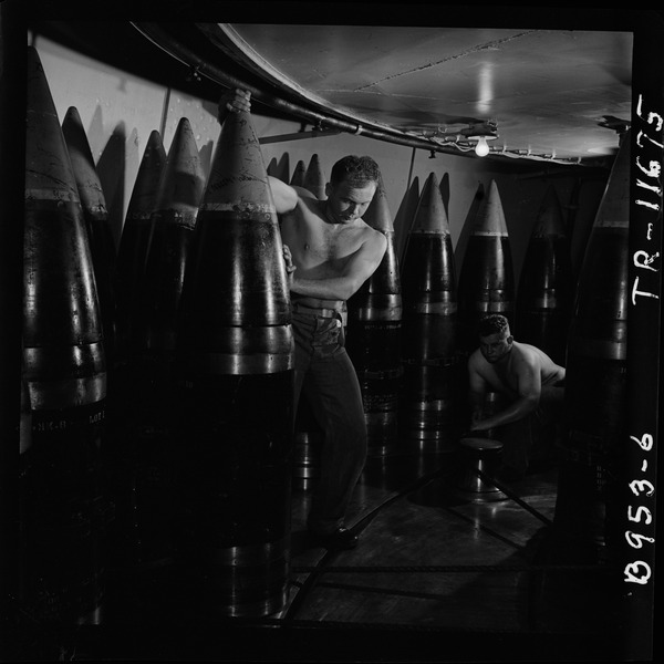 File:Ordnancemen moving 16" shell from its storage stall to ammunition hoist on board the USS New Jersey (BB-62). - NARA - 520878.tif