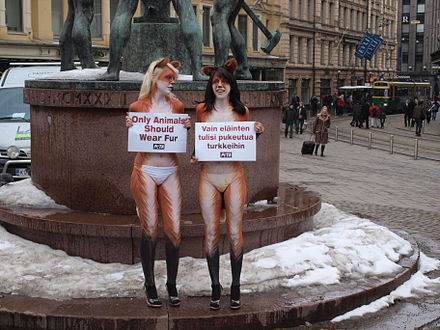 Two young women from PETA, body painted to look like foxes, protesting against the fur trade next to the Three Smiths Statue in Helsinki, Finland on March 25, 2010.