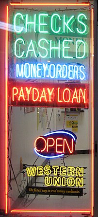 A shop window advertising payday loans.