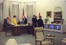 Johnson and members of his staff around the Johnson desk on April 4, 1968, watching news programs about the assassination of Martin Luther King Jr. President Lyndon B. Johnson and members of his staff watch TV news reports concerning the assassination of Martin Luther King.tif