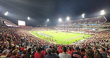 Snapdragon Stadium, home of San Diego State Aztecs football, San Diego FC, San Diego Wave FC, and the San Diego Legion Snapdragon Stadium interior-Night panorama view 1.jpg