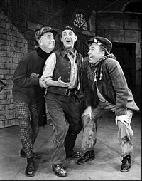 Holloway (centre) as Alfred P. Doolittle on Broadway in My Fair Lady, 1957 Stanley Holloway Alfred P. Doolittle My Fair Lady 1957.JPG