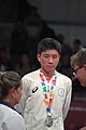 Deutsch: Tischtennis bei den Olympischen Jugend-Sommerspielen 2018: Tag 4, 10. Oktober 2018, Jungen-Einzel, Siegerehrung - Gold: Wang Chuqin (CHN), Silber: Tomokazu Harimoto (JPN), Bronze: Kanak Jha (USA); Medaillen überreicht durch IOC-Mitglied William Frederick Blick (UGA), Maskottchen überreicht durch ITTF-Präsident Thomas Weickert (GER) English: Fencing at the 2018 Summer Youth Olympics at 10 October 2018 –Boys' single medail ceremony – Gold: Wang Chuqin (CHN), Silber: Tomokazu Harimoto (JPN), Bronze: Kanak Jha (USA)); Medal presenter: IOC member William Frederick Blick (UGA), Mascot presenter: ITTF President Thomas Weickert (GER)