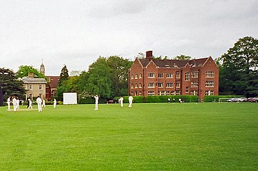 The Stamp Building (right) comprising East House, Moulton Day House, and the Modern Languages Department, with the Headmaster's House (left) and the Chapel behind. The Leys School, Cambridge.JPG
