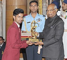 Varun Singh Bhati being awarded the Arjuna Award (2017) by the President of India, Ram Nath Kovind at Rashtrapati Bhavan in New Delhi on 29 August 2017 The President, Shri Ram Nath Kovind presenting the Arjuna Award, 2017 to Shri Varun Singh Bhati for Para-Athletics, in a glittering ceremony, at Rashtrapati Bhavan, in New Delhi on August 29, 2017.jpg