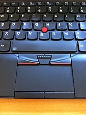 Photograph showing the keyboard and Trackpoint of the X120e model laptop