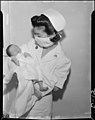 An American nurse with baby in 1942